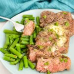 close up of a fork holding a bit of Broiled New York Strip Steak