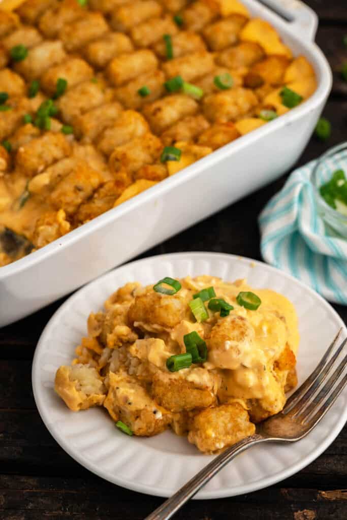 Buffalo Chicken Tater Tot Casserole on a plate with a fork.
