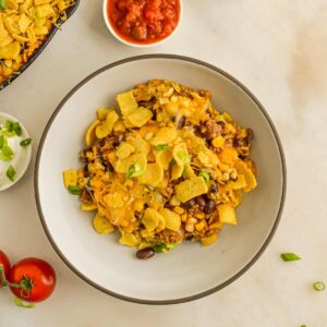 Top down view of Walking Taco Casserole in a dish.