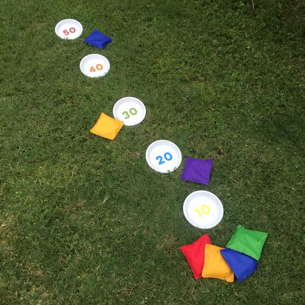 DIY Bean Bag Toss game in the grass.