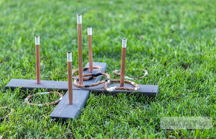 DIY ring toss game in the grass.