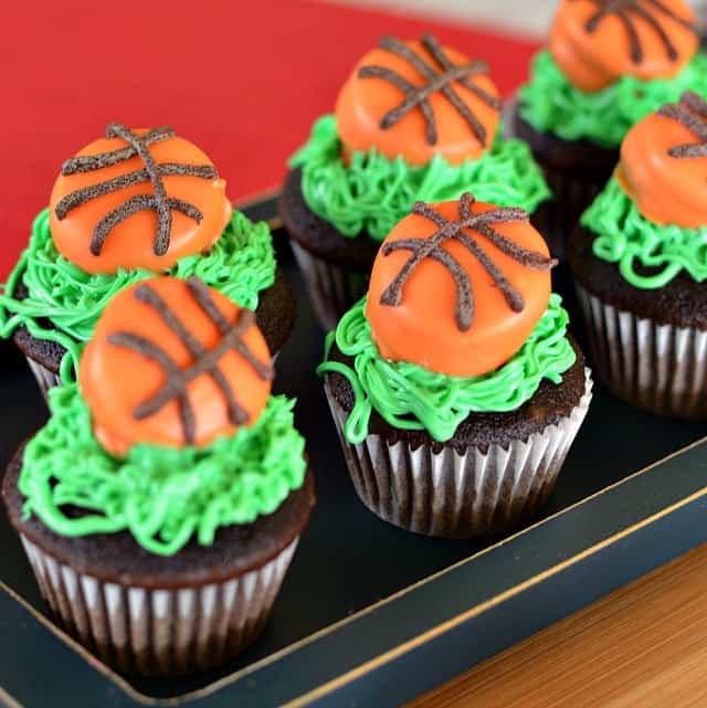 Mini basketball cupcakes topped with candy coated basketball treats.