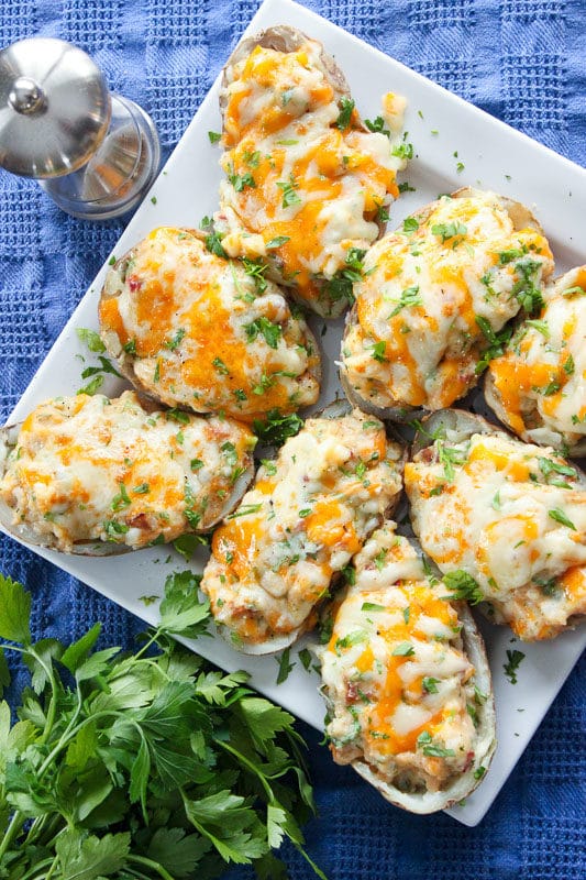 Loaded Twice Baked Potatoes on a square serving dish.