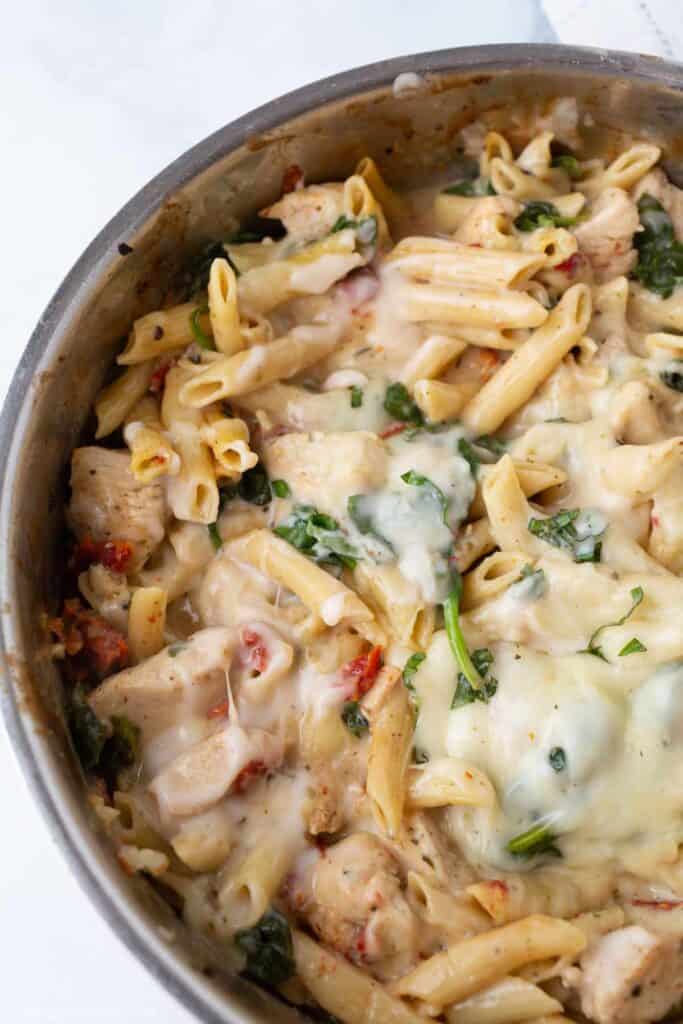 Skillet full of Creamy Tuscan Chicken Pasta