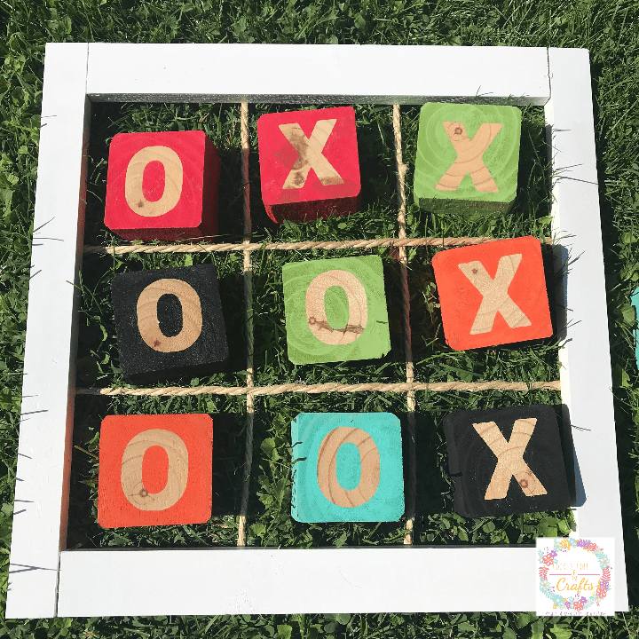 Wooden Tic Tac Toe game with wooden blocks.