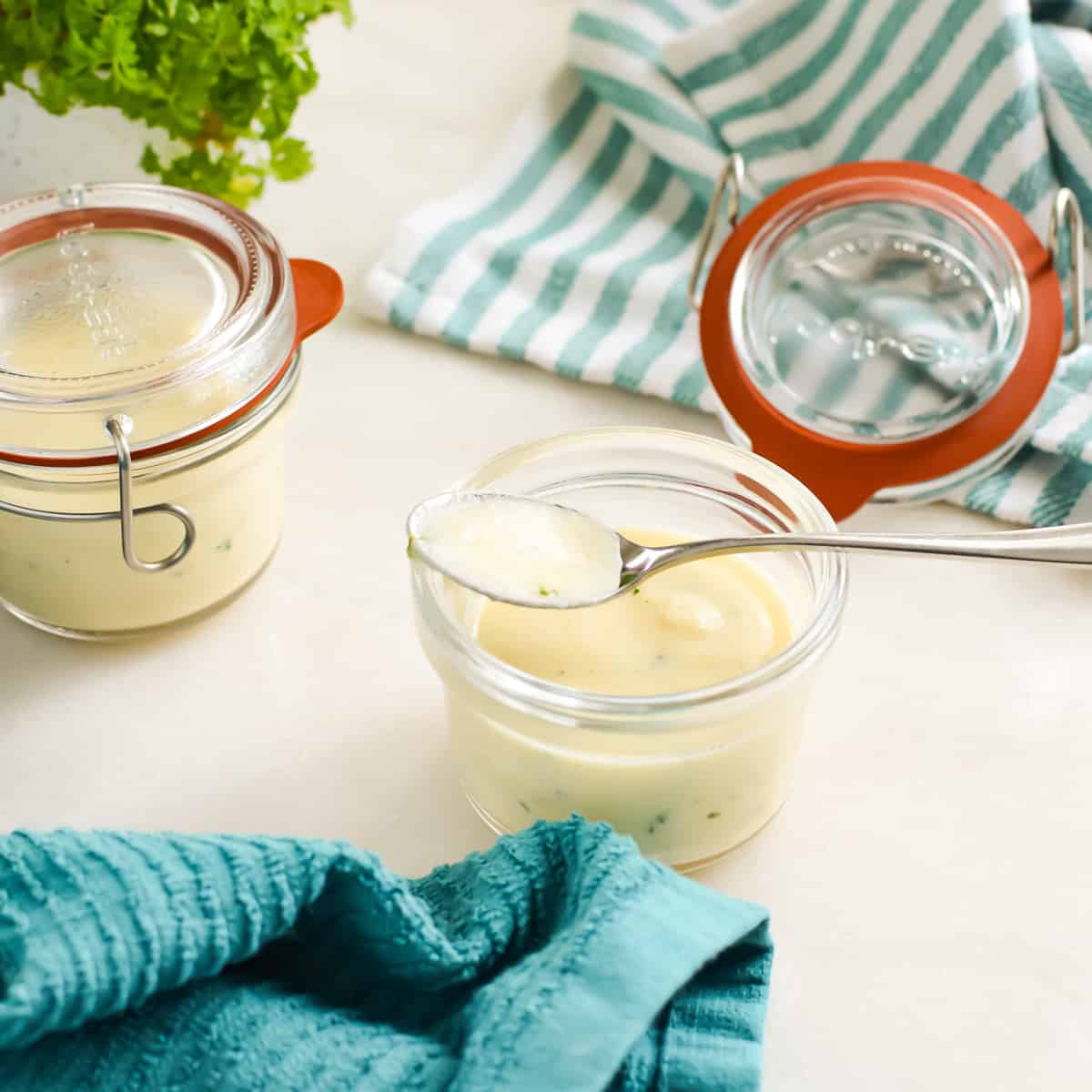 Condensed Cream Soup Base in a jar with a spoon.