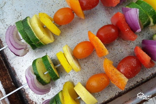 Rainbow Veggie Kabobs on a sheet pan.