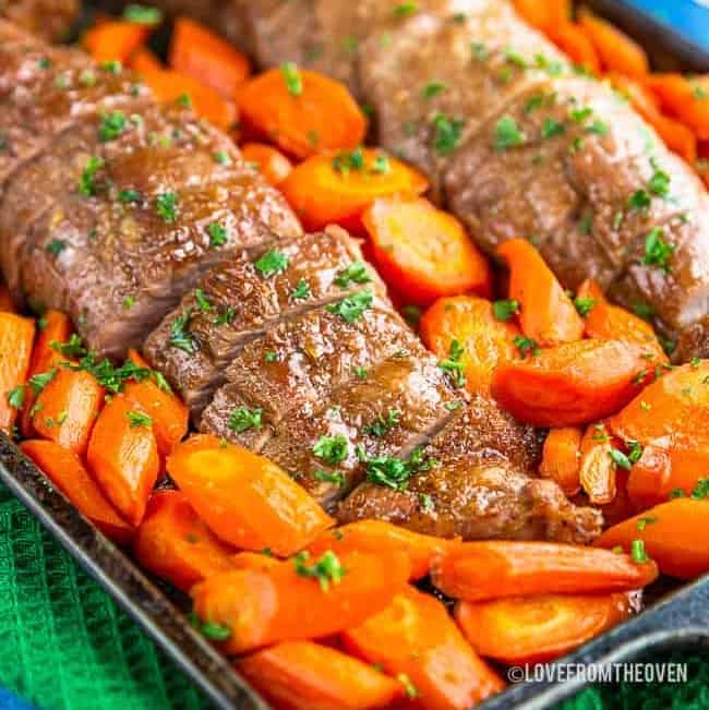 Platter of Maple Brown Sugar Pork Tenderloin with carrots.
