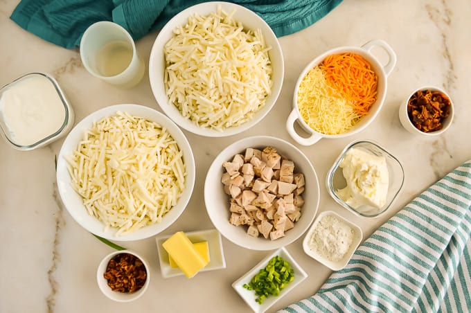 Ingredients for Chicken Hashbrown Casserole in small dishes.