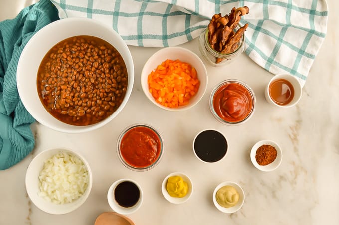 Ingredients for Cowboy Baked Beans in small bowls.