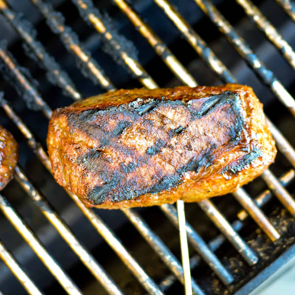 Close up of Grilled Top Sirloin Steak on the grill.