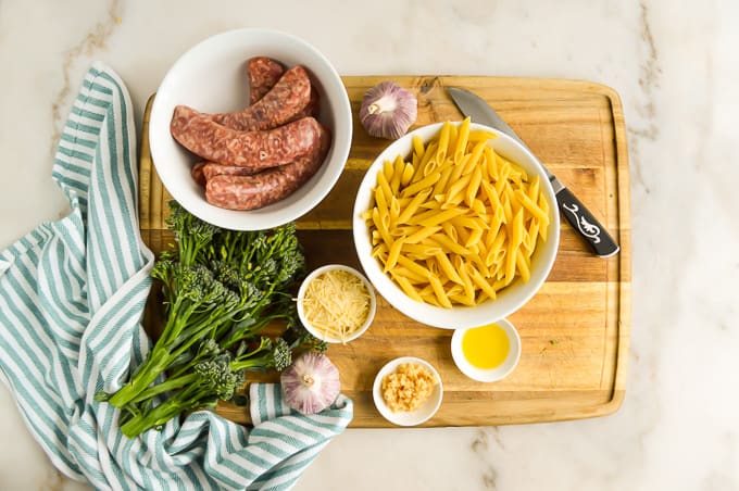 Pasta with Sausage and Broccolini Ingredients on a cutting board.