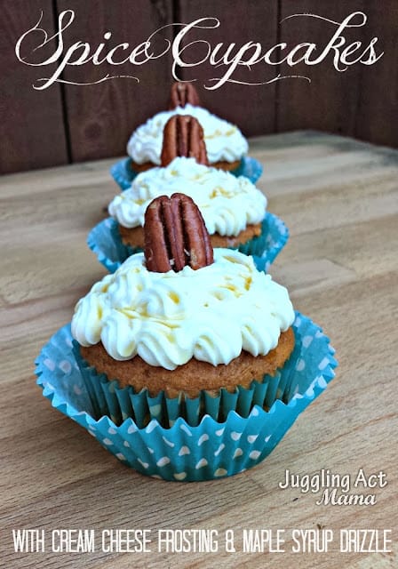 Spice cupcakes with cream cheese frosting and pecans lined up with text overlay.