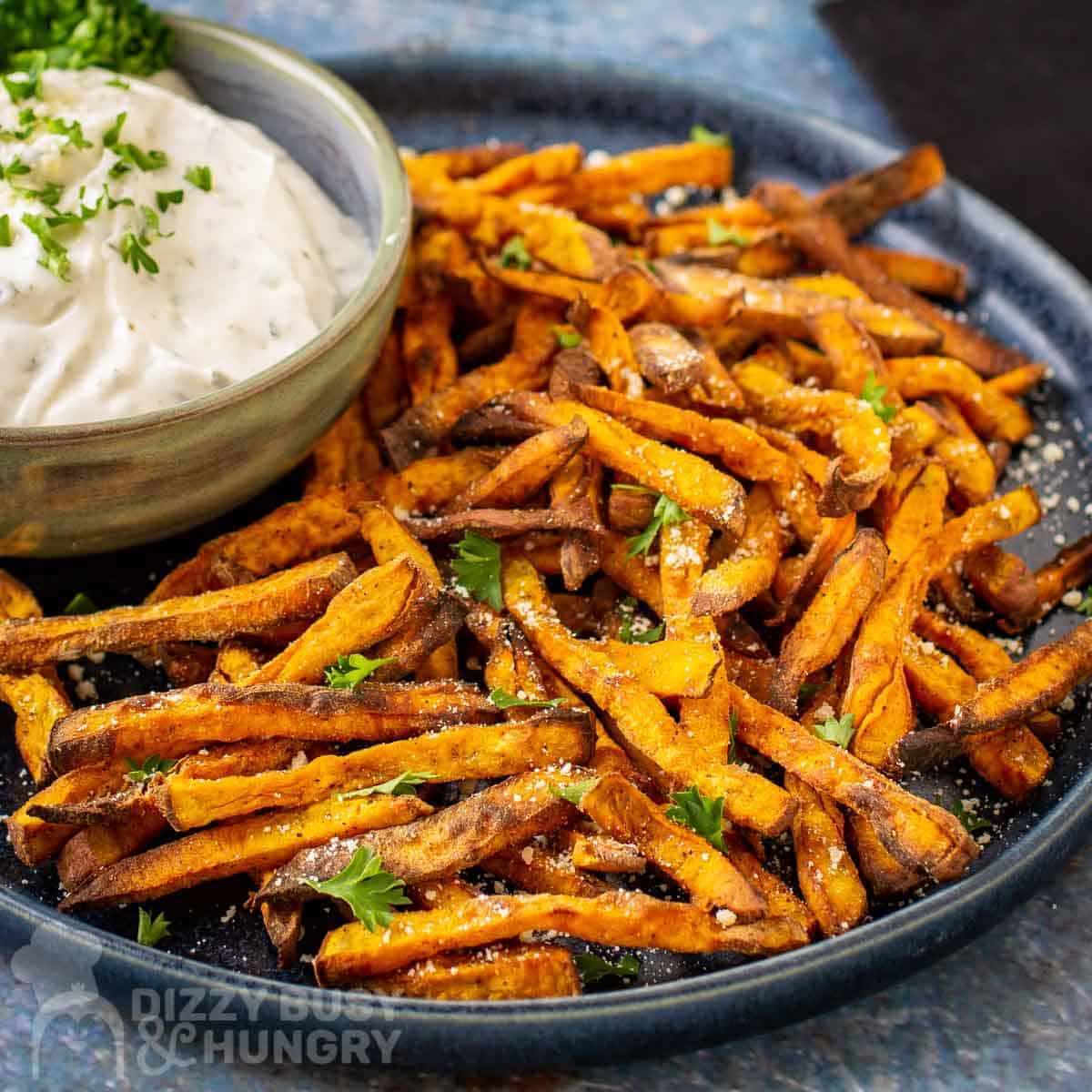 Kid Friendly Sweet Potato Recipes: plate of seasoned Air Fried Sweet Potato Fries with dipping sauce.