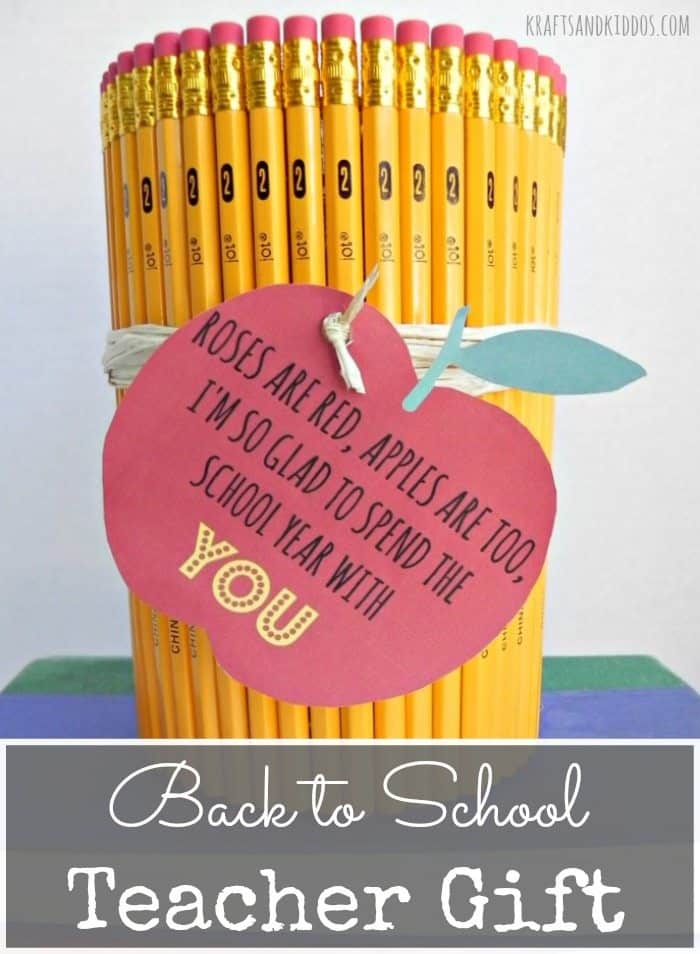 Pencil holder made of pencils with printable gift tag attached with text overlay.