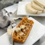 Close up of carrot bread on a white plate with Brown Sugar Butter.