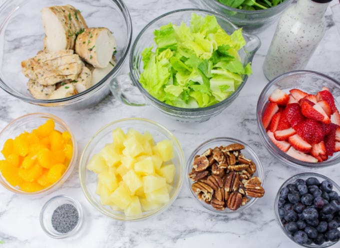 Bowl of ingredients for Panera Copycat Strawberry Poppyseed Salad.
