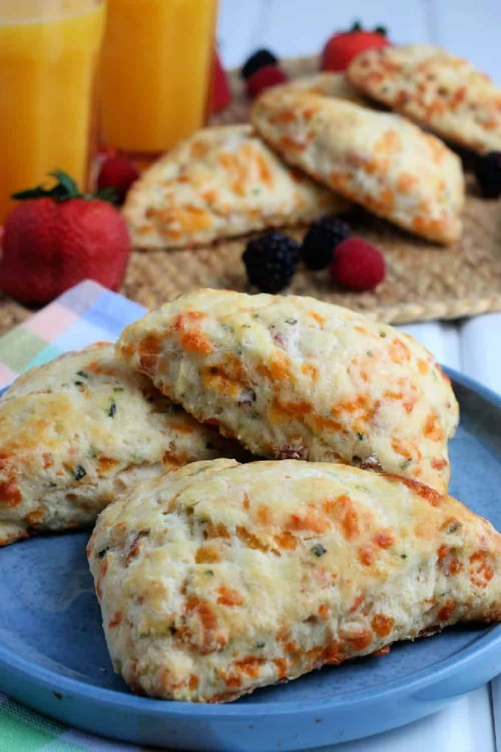 Bacon Cheddar Scones on a blue plate.