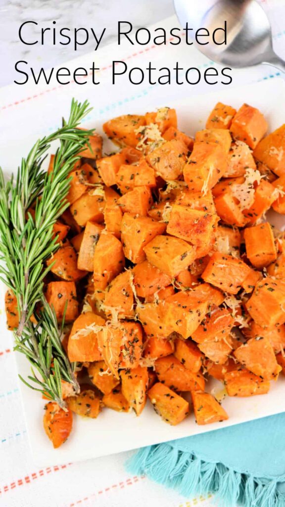 Crispy Roasted Sweet Potatoes on a white plate garlinished with fresh rosemary,