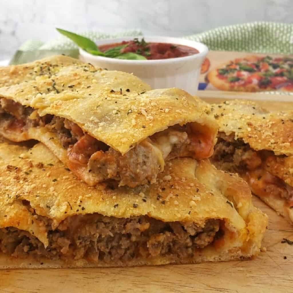 Close up of Meatball Calzone cut into pieces.