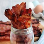 Close up of Grilled Bacon in a mason jar.