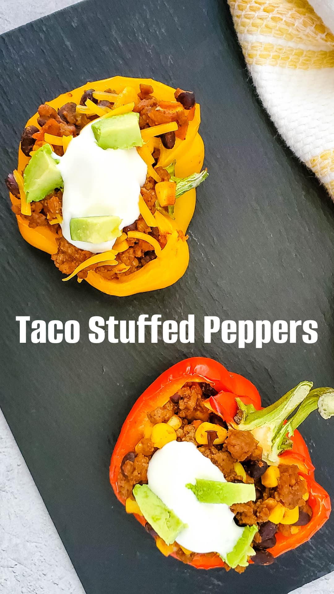 Stuffed Peppers on a black slate background with text overlay reading Taco Stuffed Peppers