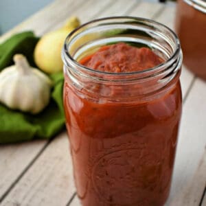 Close up of mason jar full of Homemade Tomato Sauce.