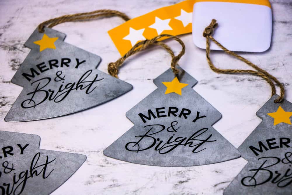 Cricut Galvanized Christmas Ornaments on a countertop.