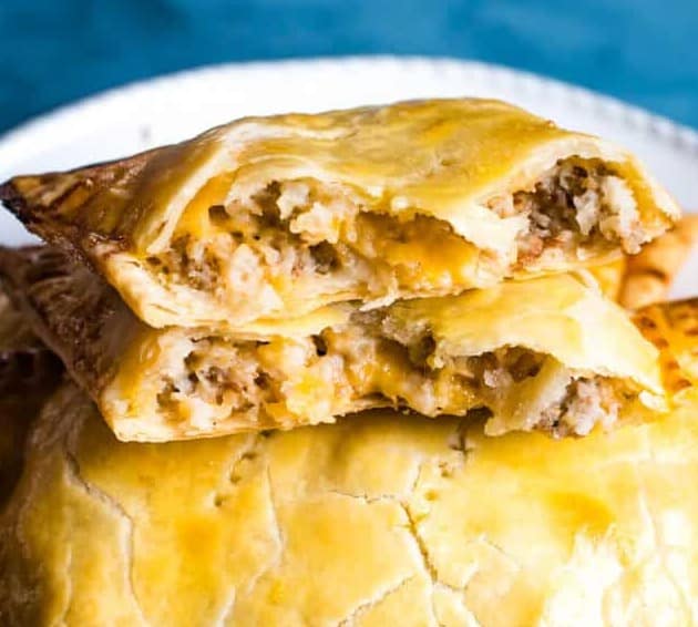 Close up of Potato Sausage Hand Pies stacked on top of one another.