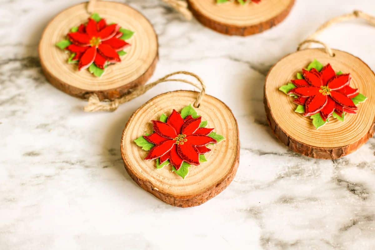Wood Slice Poinsettia Ornamentson a countertop.