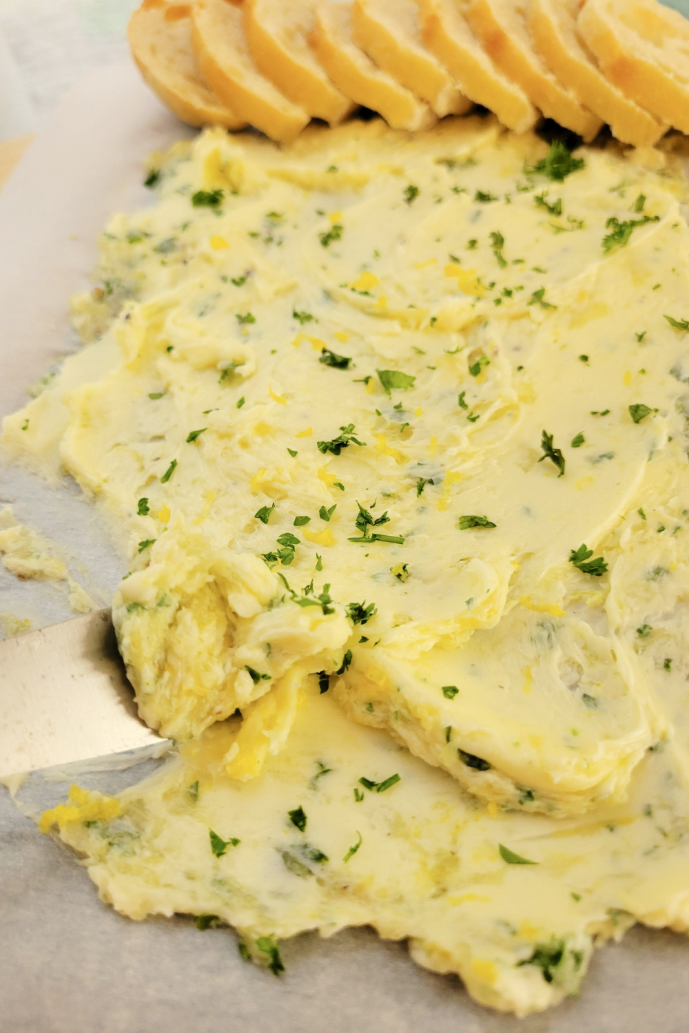 Close up of butter board and knife.