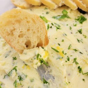 Close up of butter board and bread.