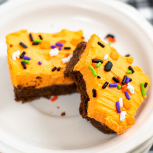Frosted Halloween Cookie Bars on a white plate.