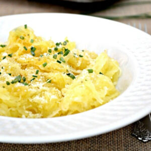 Close up of Baked Spaghetti Squash in a white bowl.