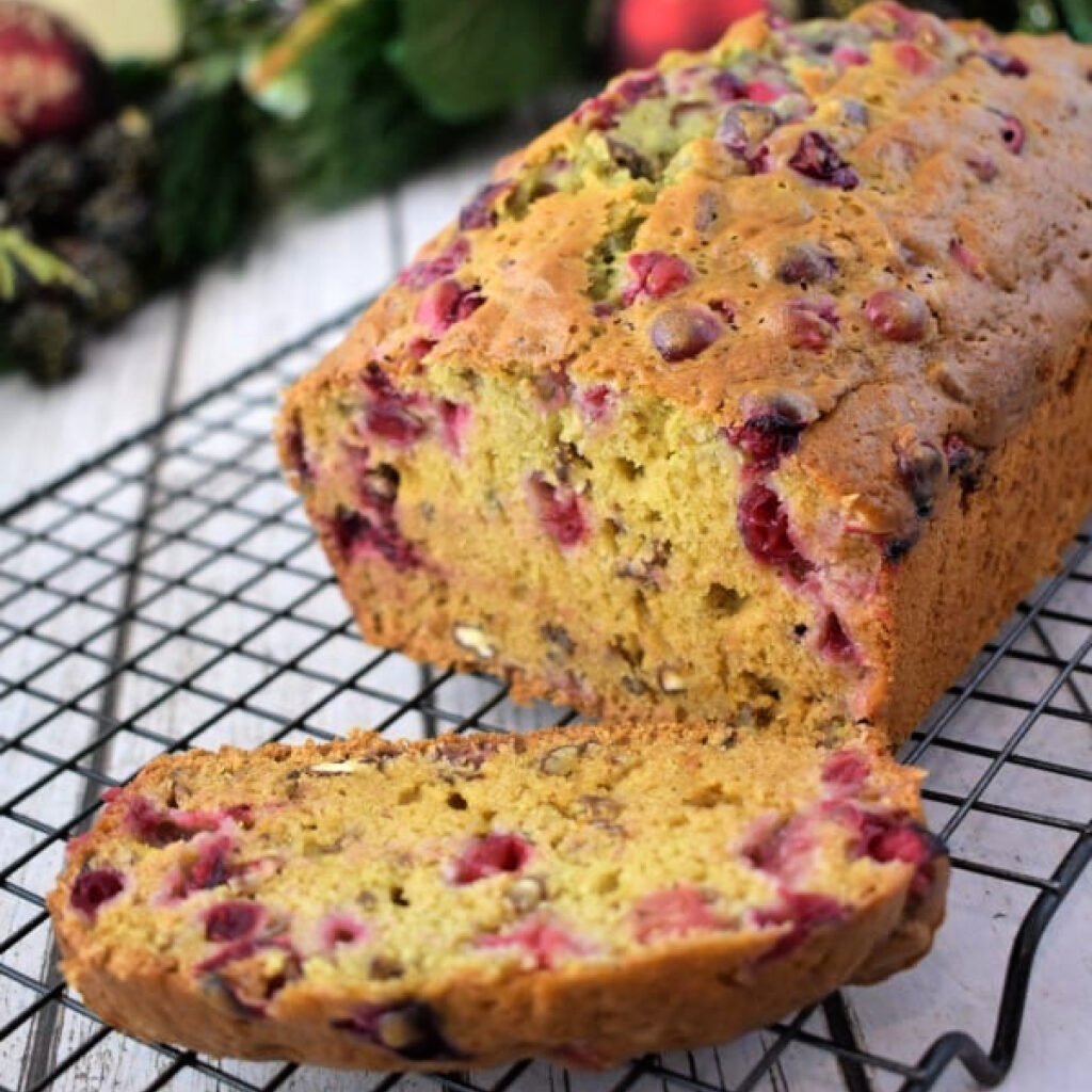 Close up of Cranberry Orange Bread on a cooling rack.