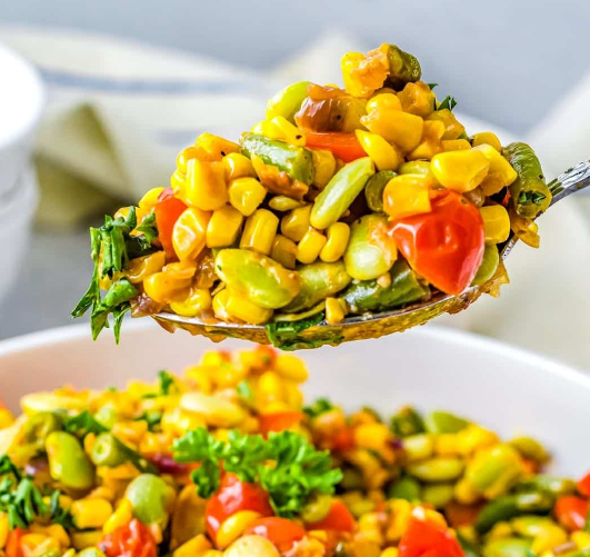 Close up of make ahead succotash with bacon and scallions for Thanksgiving.