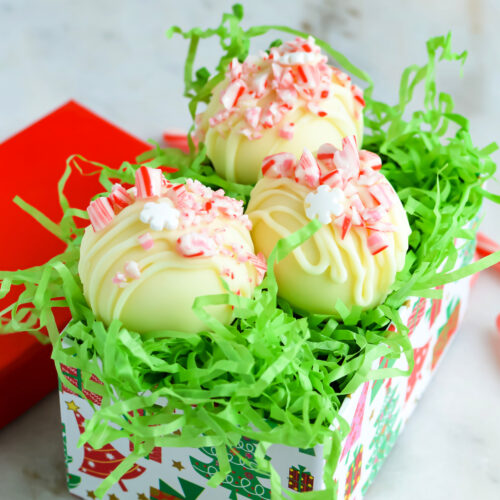 Close up of Peppermint White Chocolate Cocoa Bombs in a gift box.