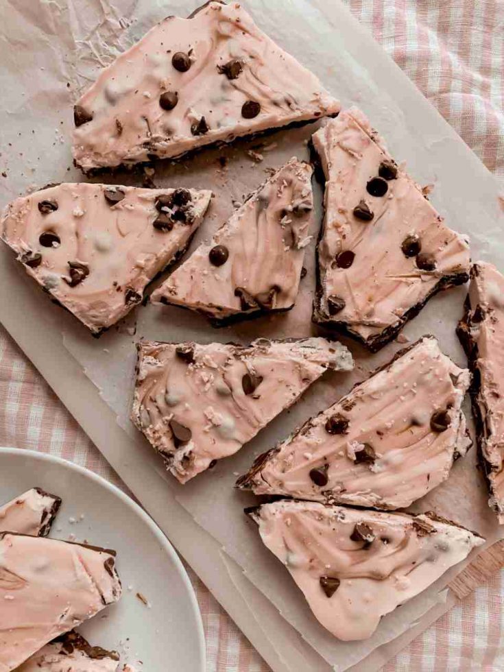 Pieces of Chocolate Chip Cookie Dough Bark on parchment paper.