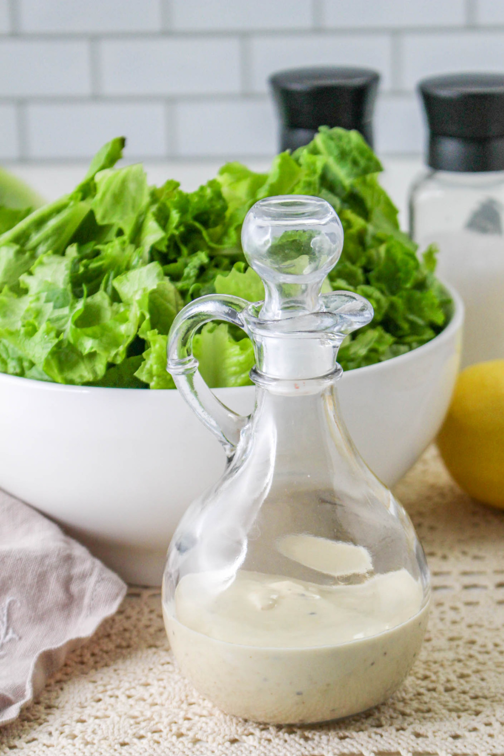 Caesar Dressing Without Anchovies in a cruet with stopper.