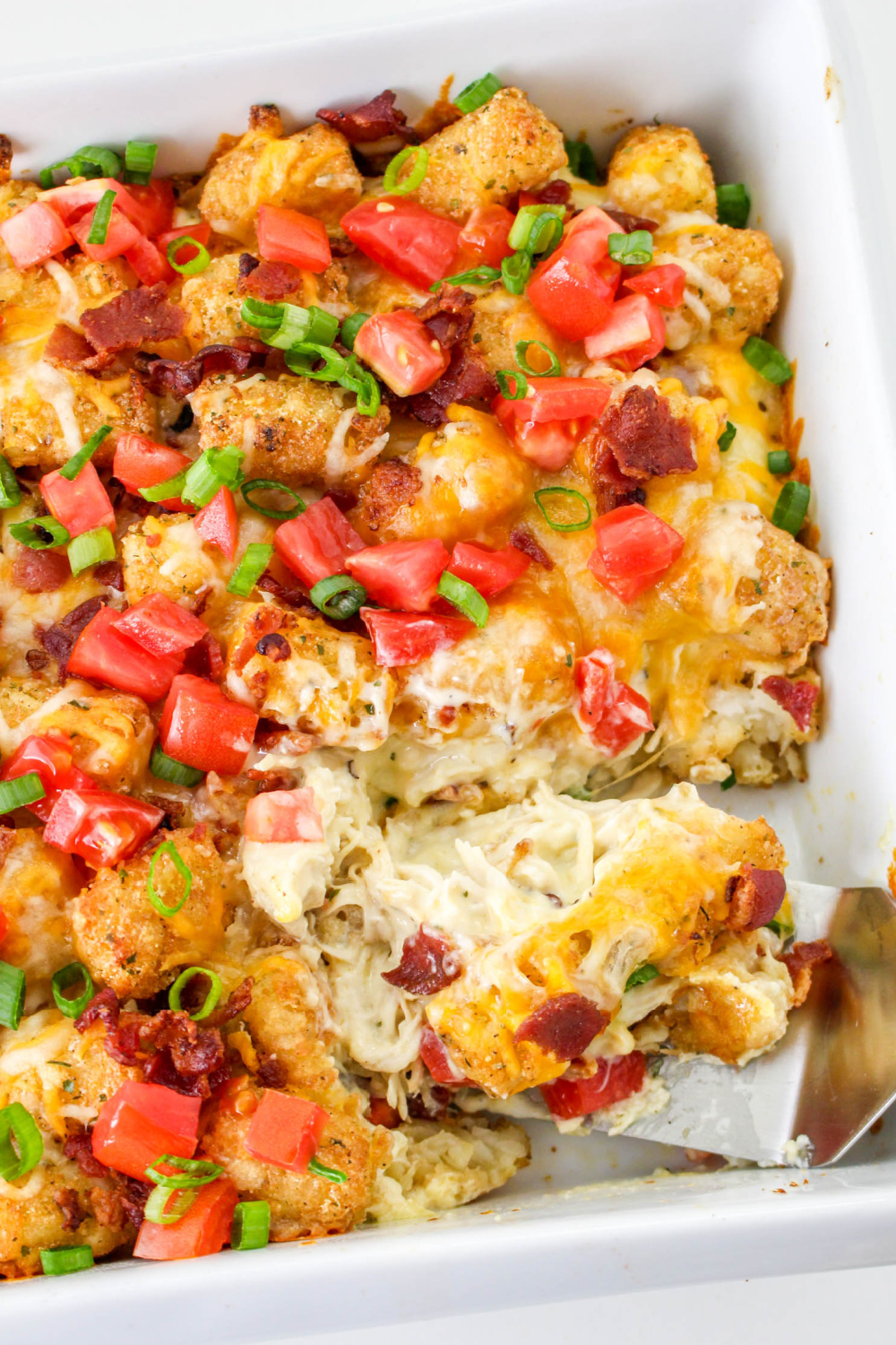 Close up of Chicken Bacon Ranch Tator Tot Casserole on a plate with a fork.