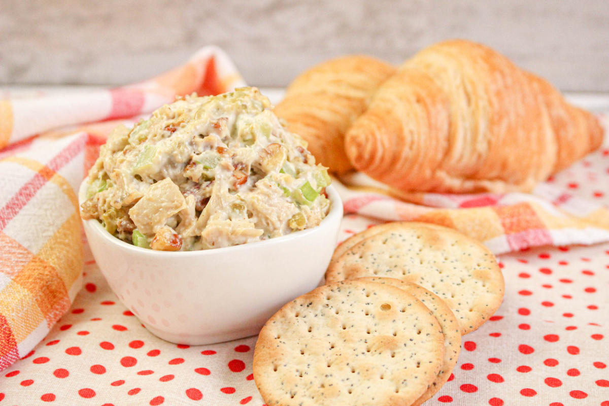 Easy Rotisserie Chicken Salad in a small bowl with crackers.