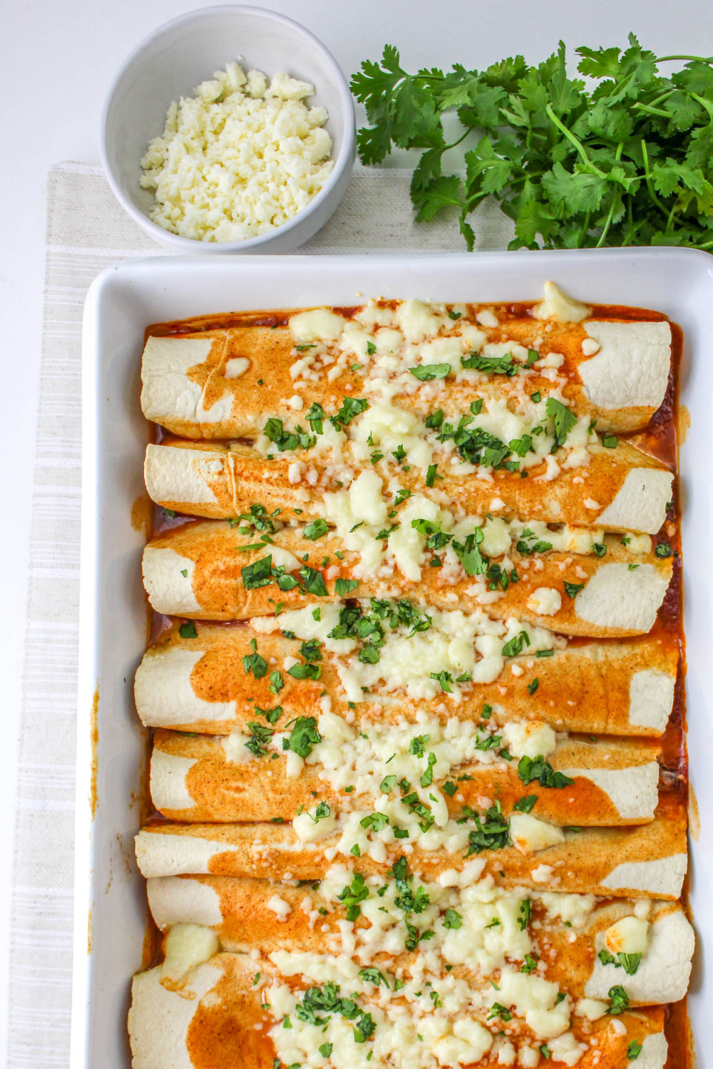 Top-down view of Shredded Beef Enchiladas in a baking dish.