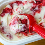 Close up of a scoop of Strawberry Shortcake Ice Cream.