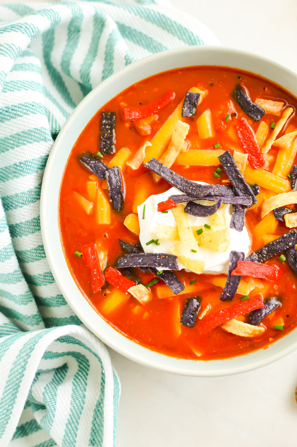 Top down view of Chicken Tortilla Soup in a bowl.