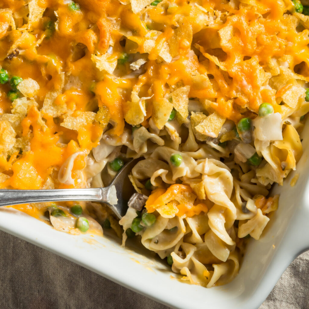 Top down view of Tuna Noodle Casserole dish with a serving spoon.