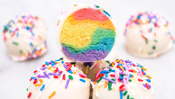 Close up of Rainbow Cake Truffles covered with sprinkles.