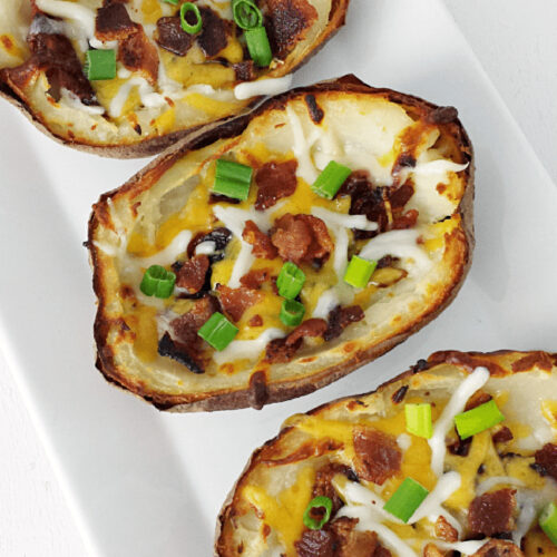 Close up of Bacon Cheddar Potato Skins on a platter.