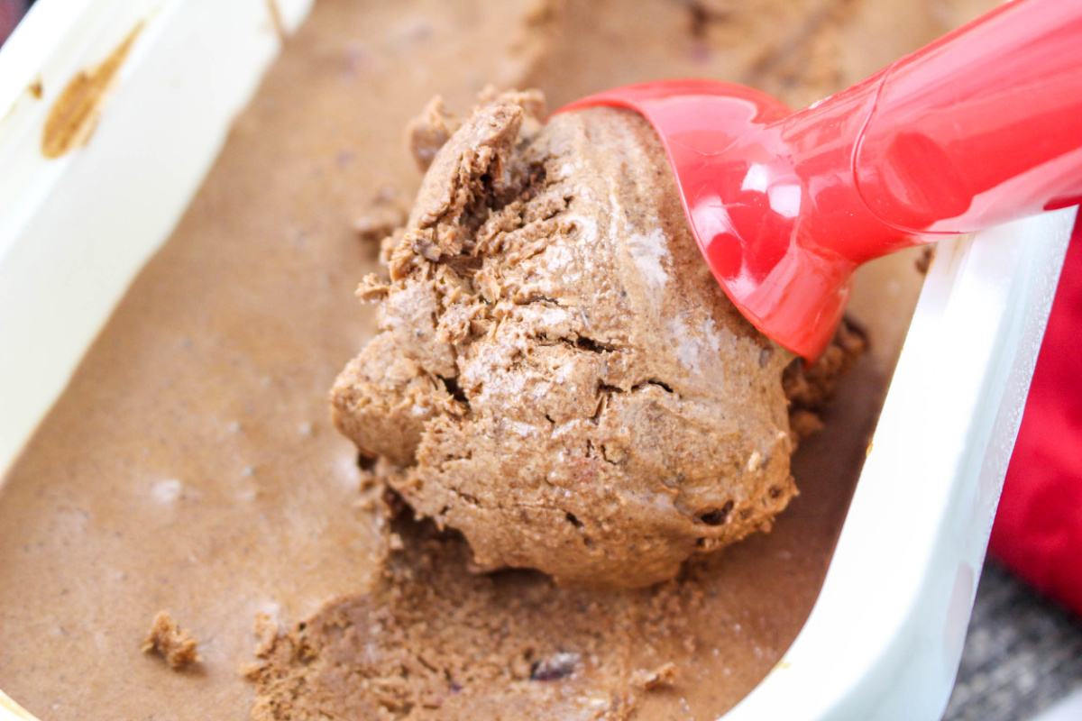 A red ice cream scoop and Black Forest Ice Cream.