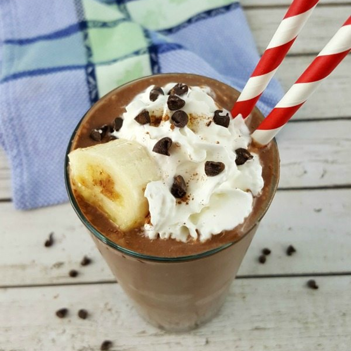 Chocolate Peanut Butter Banana Smoothie topped with whipped cream.