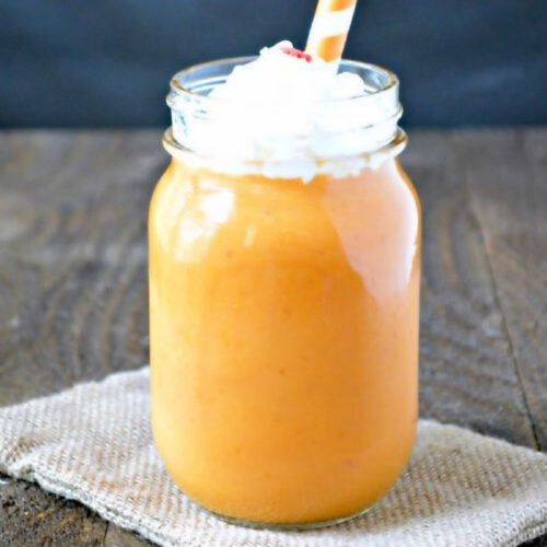 Pumpkin Pie Smoothie in a jar with whipped cream.